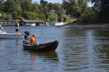 Kinderen in een optimist op de IJssel